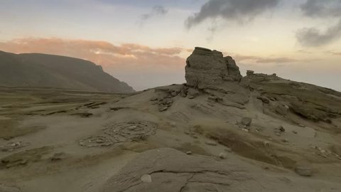 The Sphinx of Bucegi, in the Bucegi Plateau, at sunset with clouds
