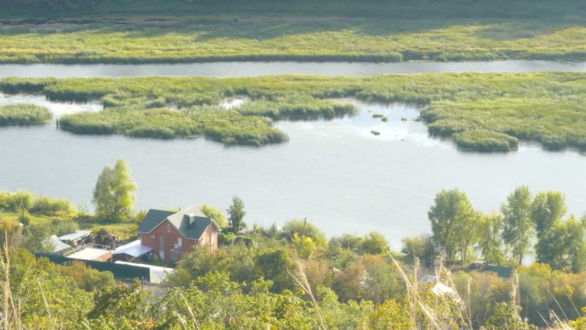 Lake House on Mountain Top surrounded by woods. View from above