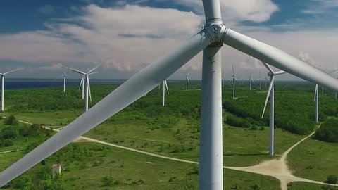 Wind turbine farm of powered windmills. Aerial view of sustainable energy