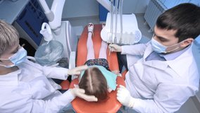 Overview of a patient being treated by dentist