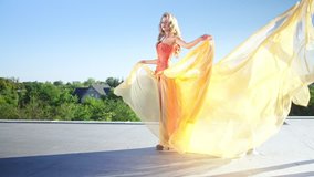 Young woman wearing fabulous dress , Red Epic 4k slow motion clip