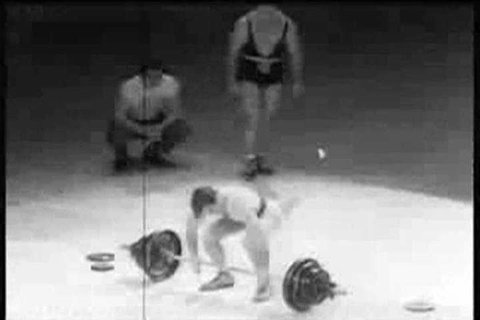 Spectators applaud weightlifters Pete George and John Davis at an Olympics Madison Square Garden benefit in 1951. (1950s)