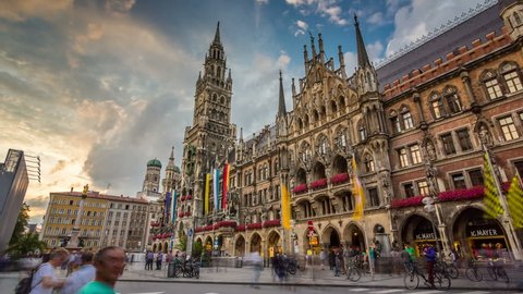 MUNICH, GERMANY - JULY 28, 2016: People in Marienplatz on the the famous Town Hall at evening, Munich, Germany. Timelapse view in 4K.