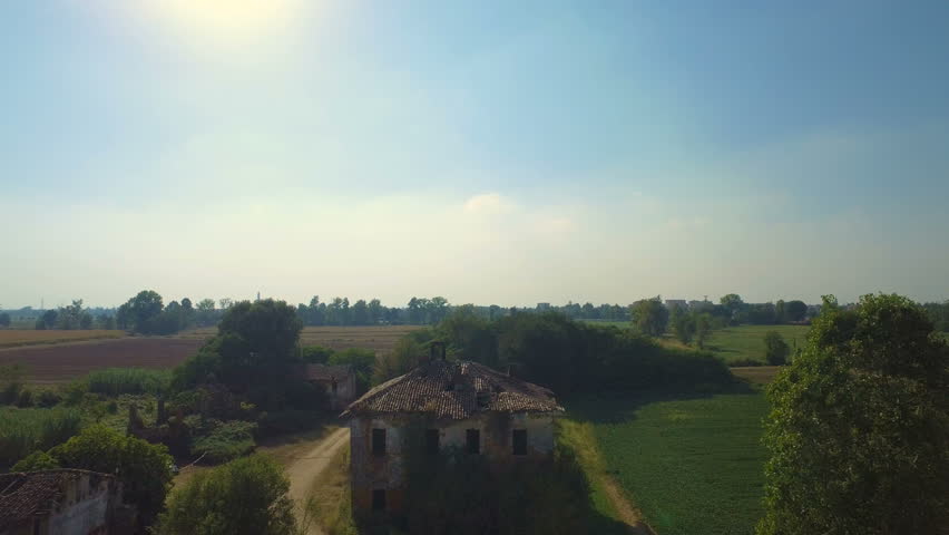 Flying over abandoned farmhouse