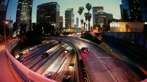 Night freeway traffic in Los Angeles city.