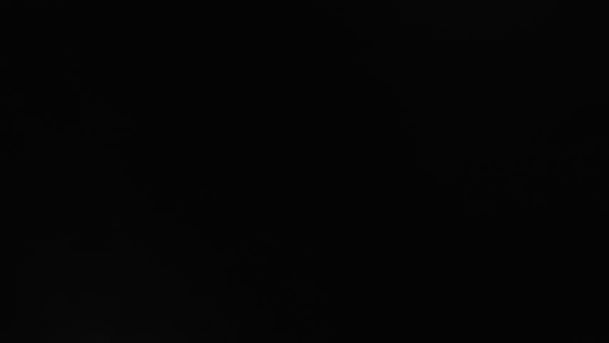 Transition from black, person walks away towards blinding white light and disappears into the abyss.