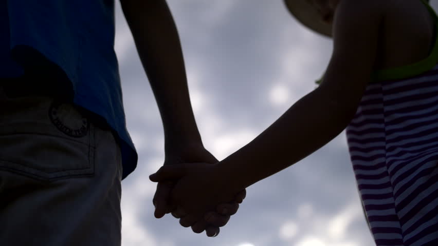 Boy And Girl Holding Hands Stock Video 100 Royaltyfri Shutterstock