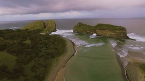 4k Arial drone footage of epic ocean mountain tropical cliff at sunset. 