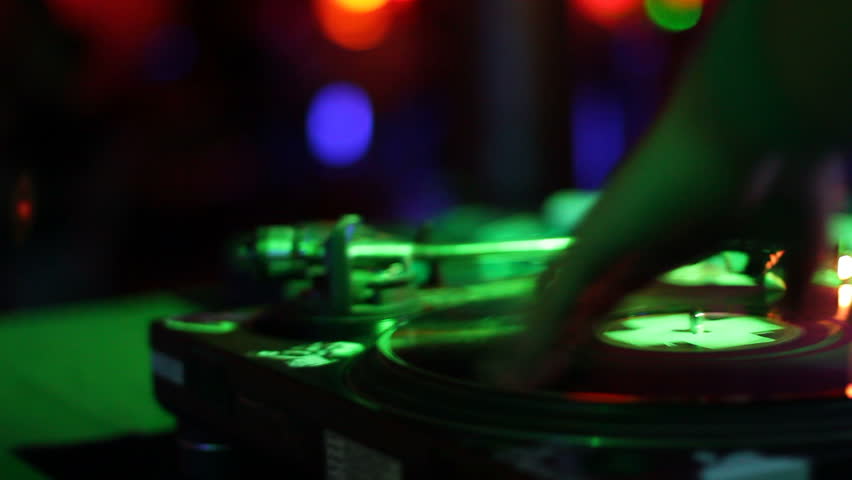 DJ spins records at club