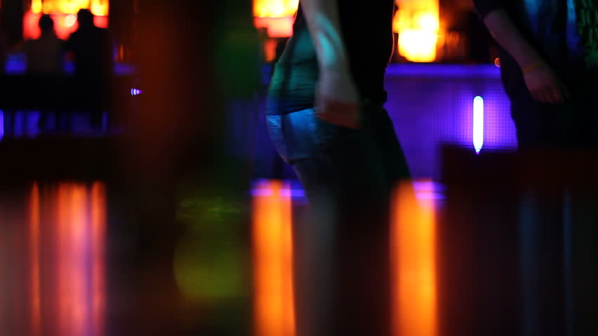 Young woman dances in club
