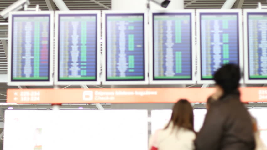 Passengers at departures timetable 3