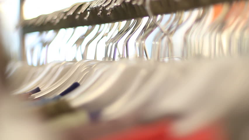 Multitude of clothes hangers in store