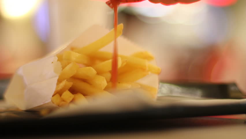 Ketchup and fries in fast-food restaurant
