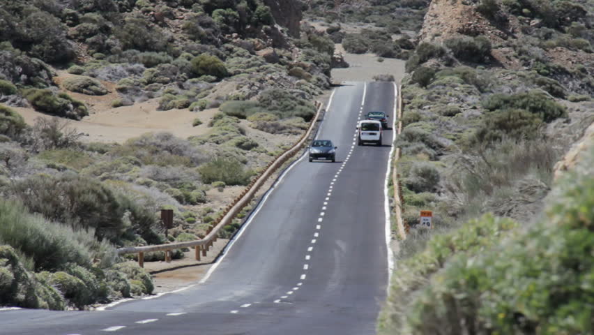 Mountain road on a hod day with cars on Tenerife Island