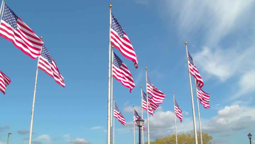 American Flags in the wind on blue sky