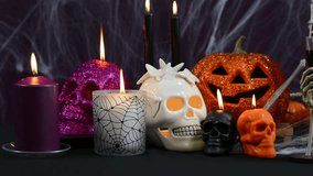Spooky Halloween Party Table candle decorations slow pan right. - Powered by Shutterstock - Get 15% off with code: PIKWIZARD15