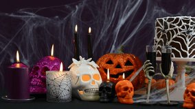 Spooky Halloween Party Table with chocolate spider cake and decorations, full table pan right. - Powered by Shutterstock - Get 15% off with code: PIKWIZARD15