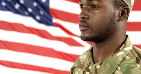 Military soldier saluting against the US flag background 4k 스톡 비디오