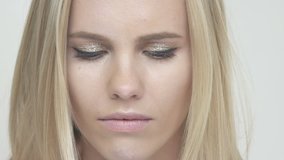 Face of upset offended young beautiful blonde woman looking at camera