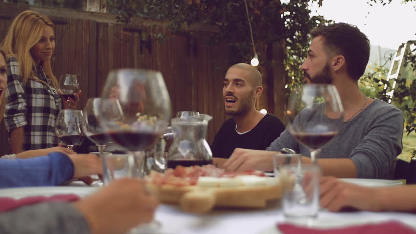 Group of friends enjoying together at a dinner party
 | Shutterstock HD Video #19788028
