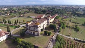 Aerial shot, gorgeous classic italian villa in tuscany flyover, made with drone