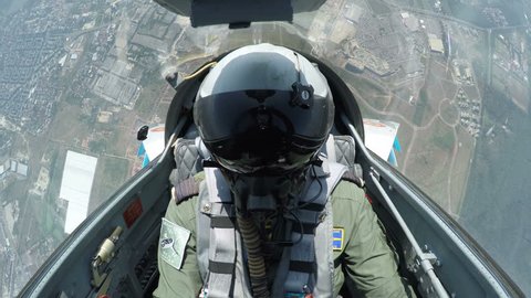 POV shot from the cockpit of a fighter plane.