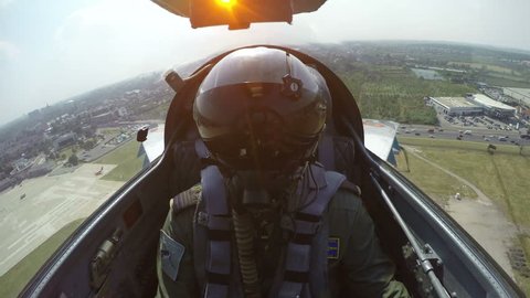 POV shot from the cockpit of a fighter plane.