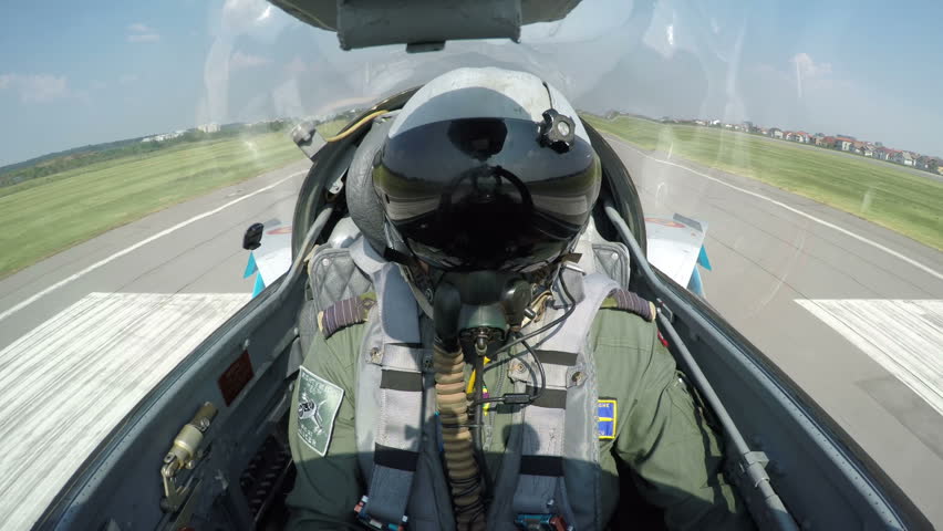 POV shot from the cockpit of a fighter plane - shot of a fighter jet taking off from the ground.
