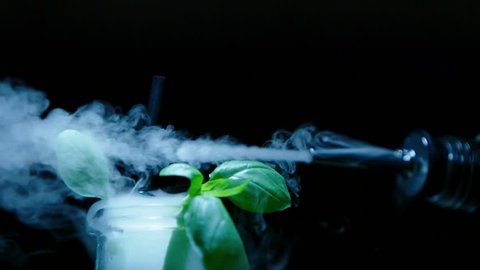 Smoke molecular drink on the black background / sony fs7