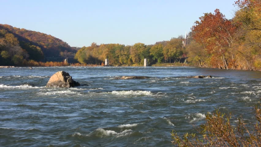 Rapids of the Potomac River with Harpers Ferry National Historical Park in West Virginia seen in the distant middle. Video shot from Maryland with Virginia on the other side of the river.