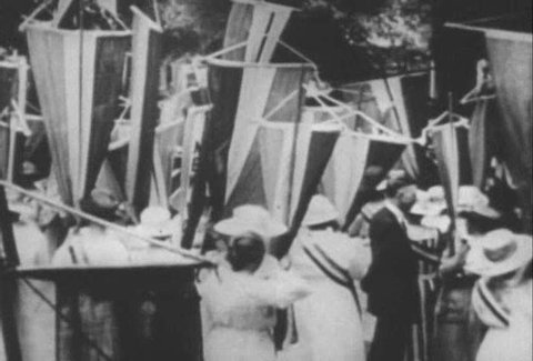 Archival footage shows American suffragettes marching and campaigning for their rights (narrated in 1961). (1960s)
