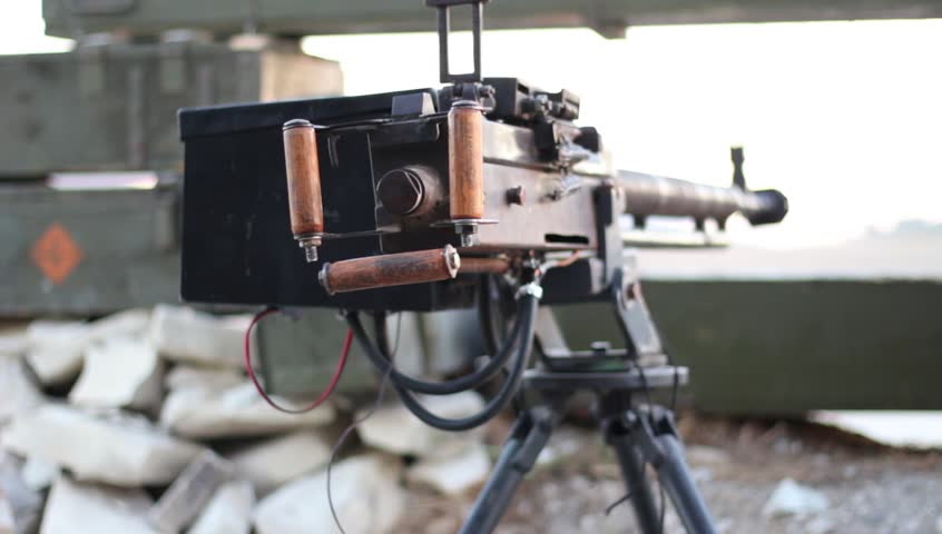Close-up Heavy machine gun in the trenches. War in real mode