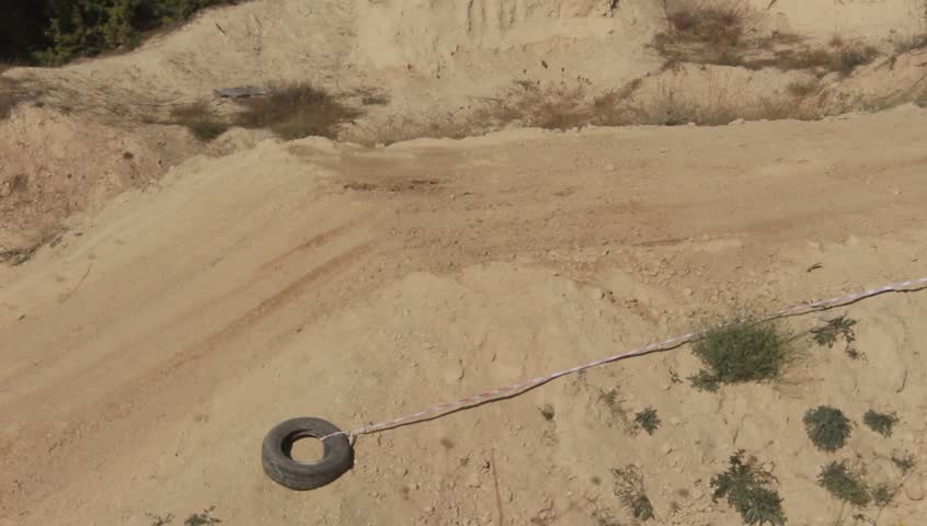 Moto Cross Bikers are Jumping over Hill at the Competition