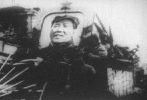 Mao Tse-tung, with troops and fanfare, proclaims the birth of the People\xCDs Republic of China on October 1, 1949. (1940s)