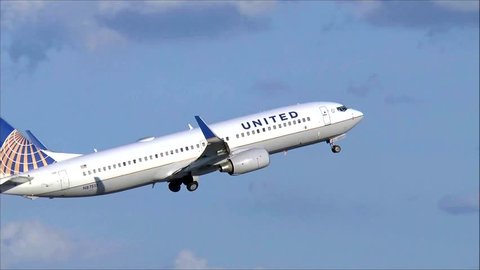 United Airlines plane taking off - Logan Airport, Boston USA - August 12, 2014