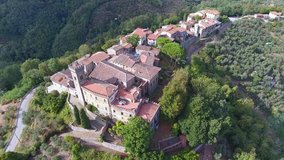 Aerial shot, gorgeous classic small tuscany village on the hill flyover, made with drone
