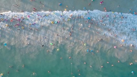 Aerial view of domestic Chinese tourists swimming and cooling off at Dadonghai bay, a popular destination on Hainan island in the South China Sea.
