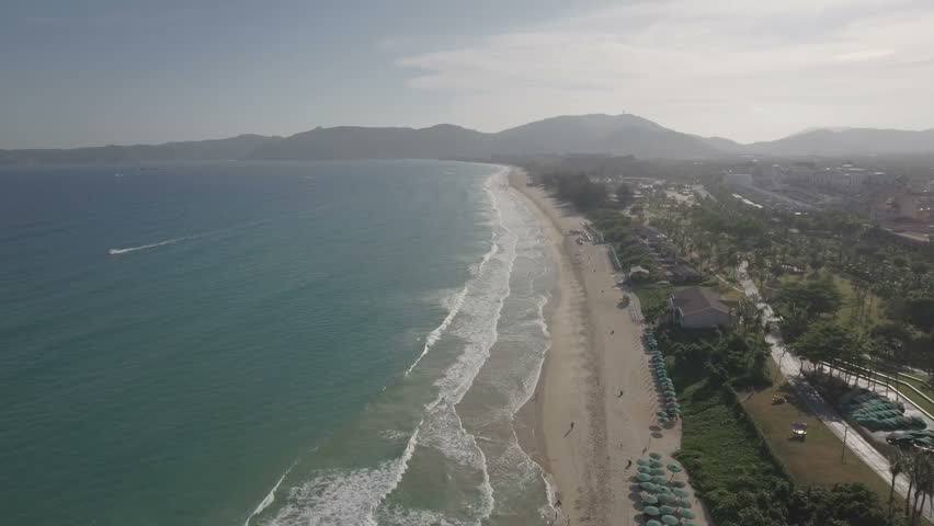 Aerial flight over Yalong Bay, a popular holiday destination in the Sanya region, particularly known for its vast number of luxury hotel resorts, Hainan island, South China Sea. 