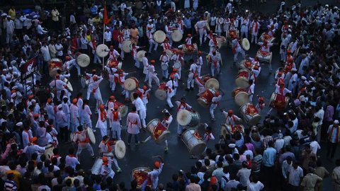 AMRAVATI, MAHARASHTRA, INDIA, 19 SEPTEMBER 2016: Drummer perform in Lord Ganesha procession for Ganesh Chaturthi, people celebrating Ganesh Chaturthi with music and drums.