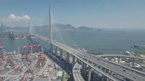 HONG KONG - JULY 2016: Aerial drone flight past the modern cable-stayed Stonecutters bridge in Hong Kong. D-log profile on DJI Phantom.