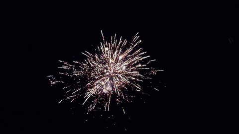 Brightly colorful fireworks and salute of various colors in the night sky in slowmotion. 1920x1080