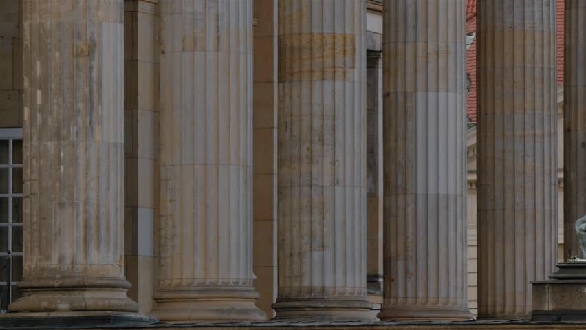 Real time close up pan shot of sculptures in front of Concert Hall, which is known as Konzerthaus at Gendarmenmarkt square in Berlin, Germany.
