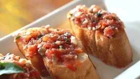 Antipasto Bruschetta, baguette slices topped with tomatoes basil mixed sauce 