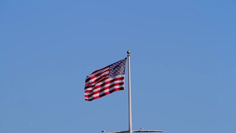 The US national flag above the pier in Santa Barbara, California, USA