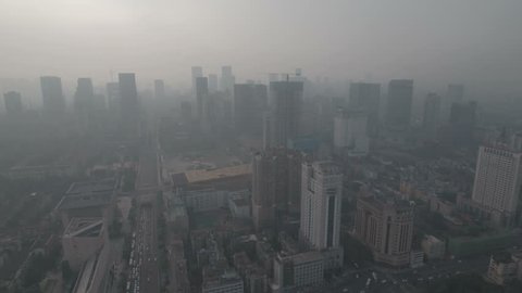 Flying towards downtown Chengdu in central China, smog and air pollution on a hazy day. D-log profile DJI Phantom.
