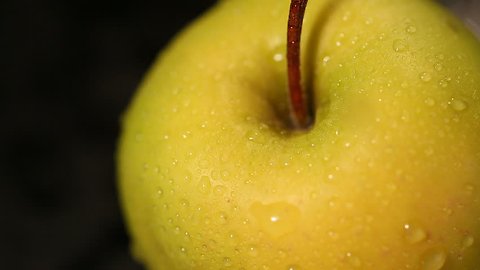 Organic green apple covered in water drops, refreshing juicy fruit, healthy diet