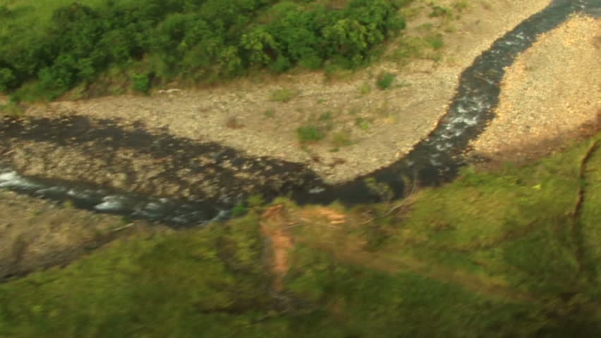 HD: flying over a river and grassland