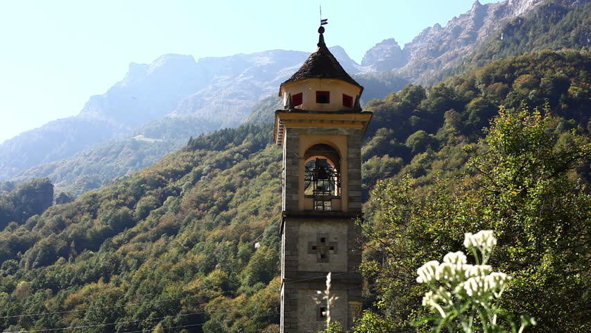 Lonely church tower in alps, italy