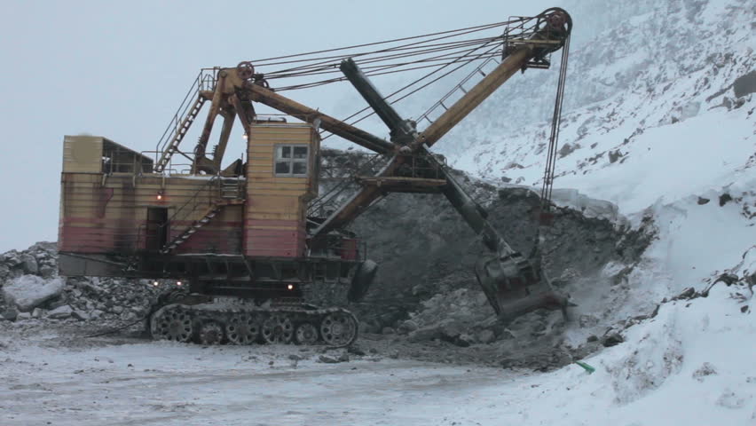 huge mining excavator mining the ore