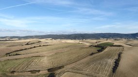 aerial shot, gorgeous tuscany hills landscape, flying above the fields